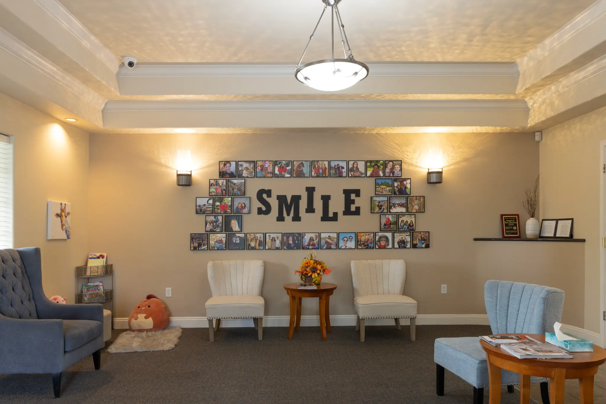 SMILE photo wall featuring our patients and team